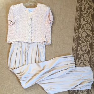 Ivory crushed jacket over jumpsuit.